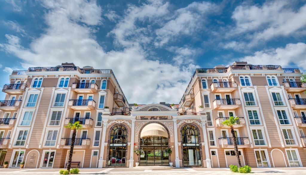 a large building with two tall buildings at Dawn Park Deluxe in Sunny Beach