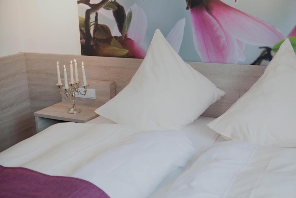 Postel nebo postele na pokoji v ubytování Ringhotel Alfsee Piazza