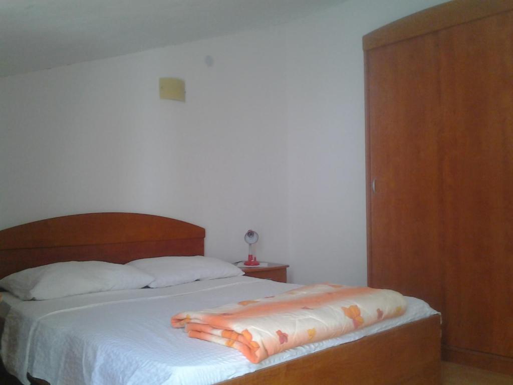 Postel nebo postele na pokoji v ubytování Apartments Vlasic