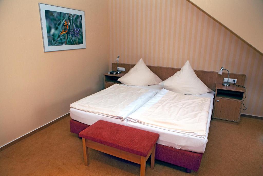 Postel nebo postele na pokoji v ubytování Ringhotel Alfsee Piazza