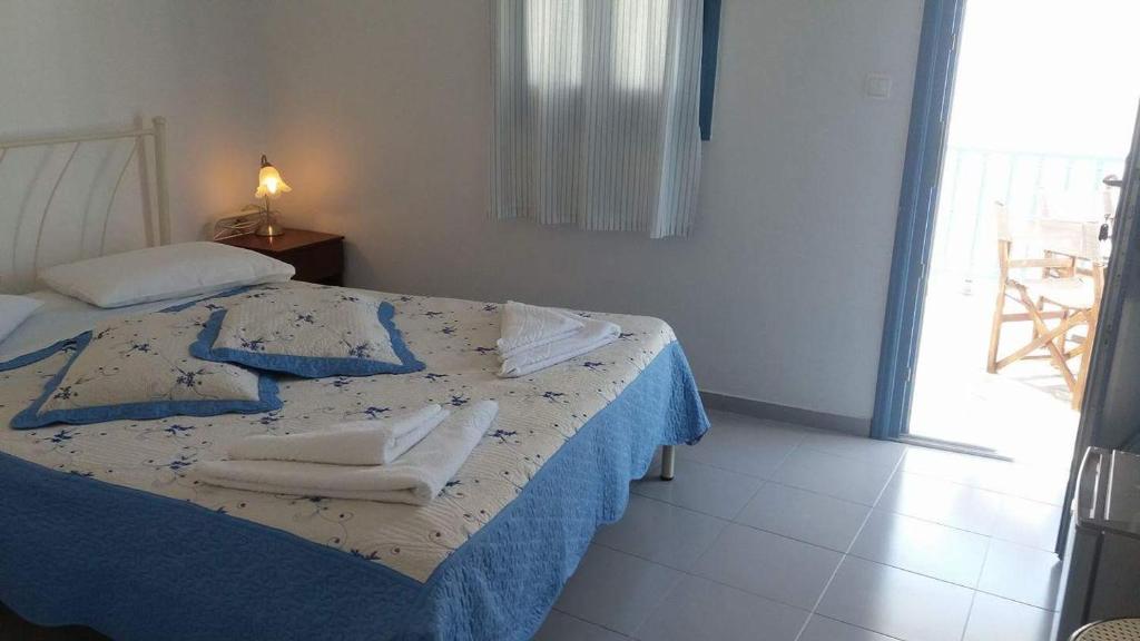 Postel nebo postele na pokoji v ubytování Artemis Rooms