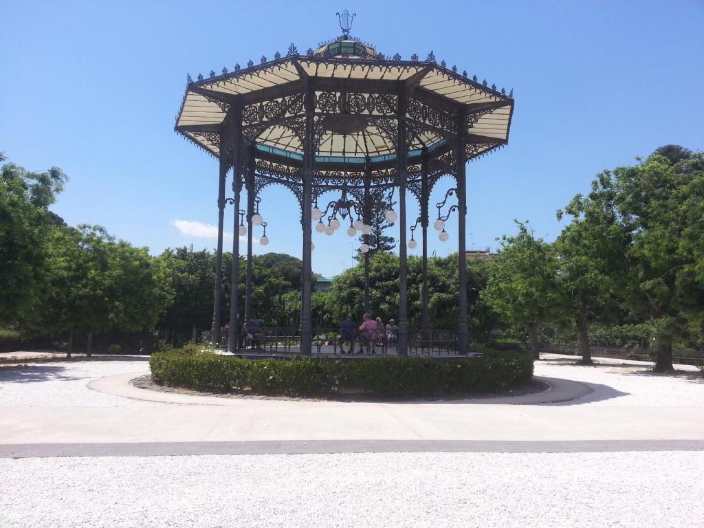 a large gazebo in a park with people in it at Guglielmo room's B&B in Catania