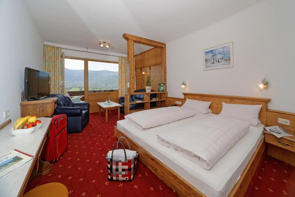 Postel nebo postele na pokoji v ubytování Osserhotel - B&B am Osser