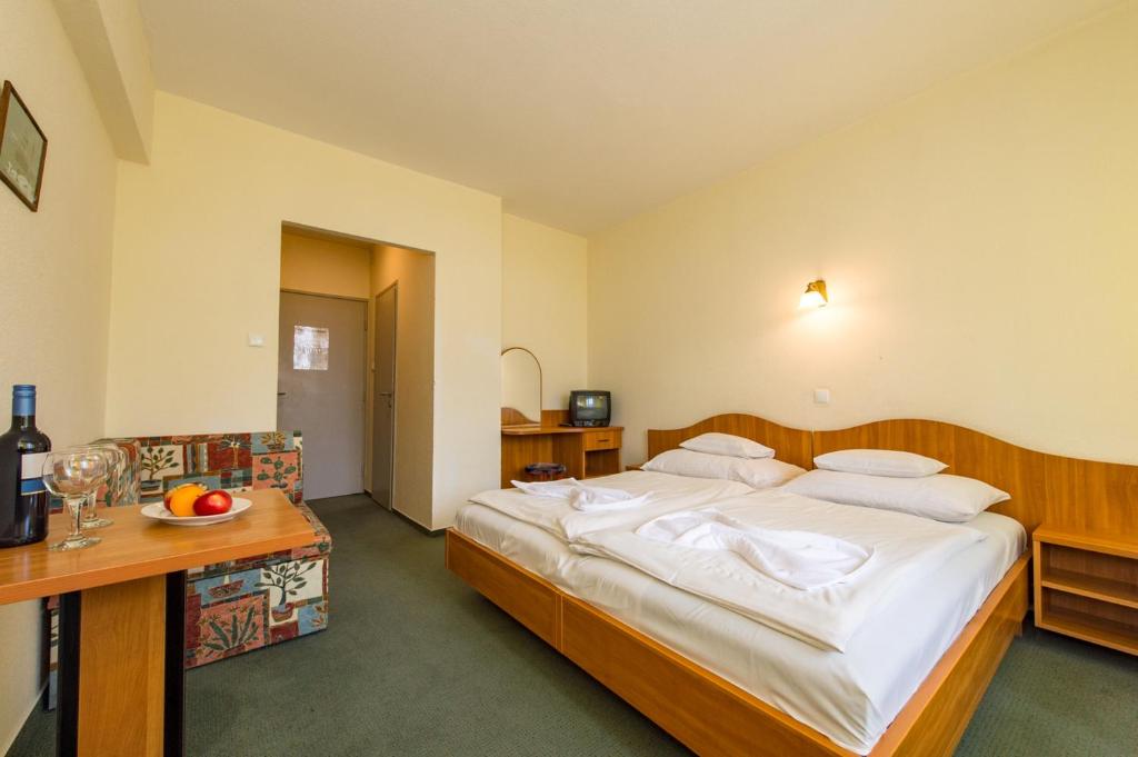 Postel nebo postele na pokoji v ubytování Hotel Nostra