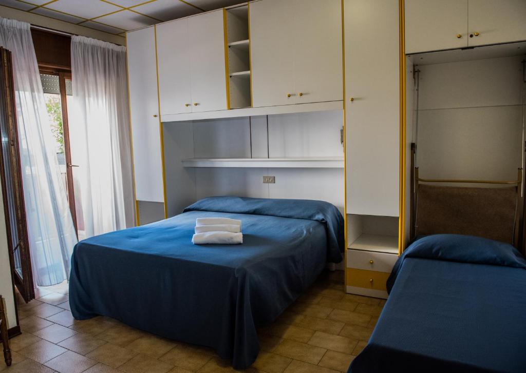 Postel nebo postele na pokoji v ubytování Hotel Malibran
