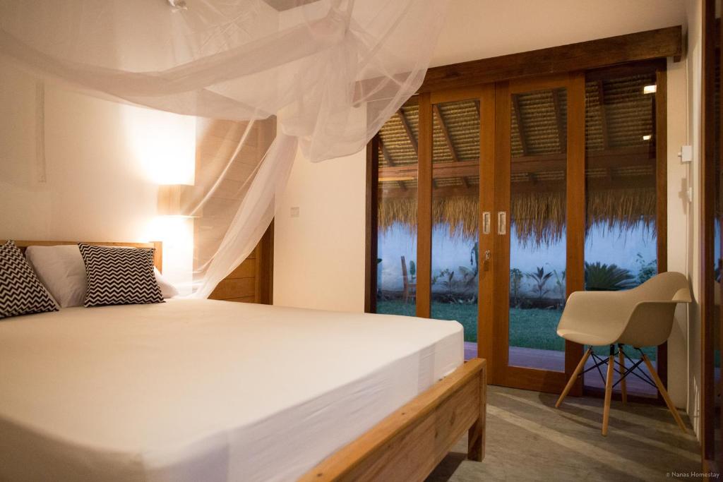 Postel nebo postele na pokoji v ubytování Nanas Homestay bungalow
