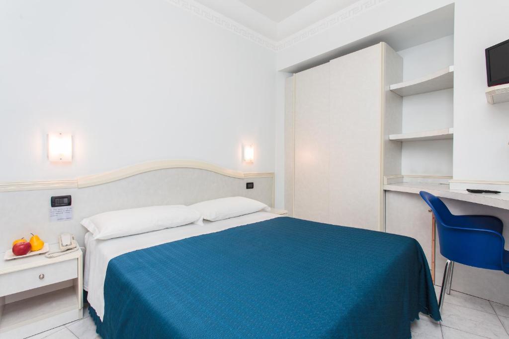 Postel nebo postele na pokoji v ubytování Hotel Oriente
