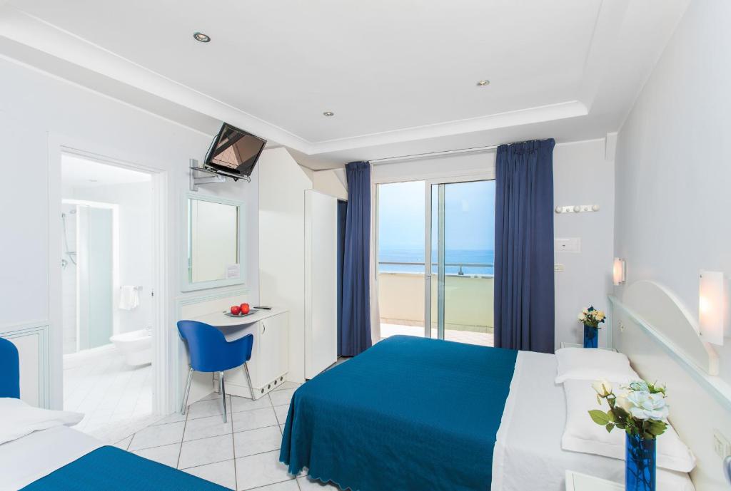 Postel nebo postele na pokoji v ubytování Hotel Oriente