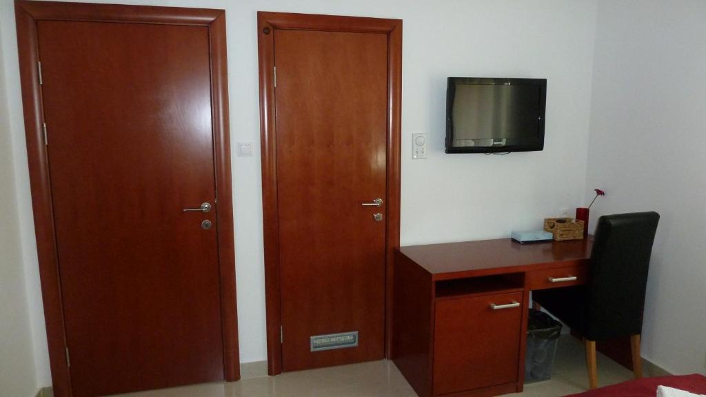 TV a/nebo společenská místnost v ubytování Guesthouse Villa Inn