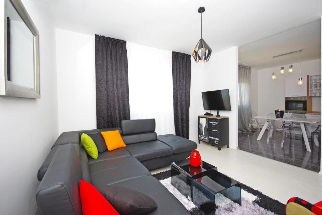a living room with a couch and a table at "NM" Luxury apartments in Split
