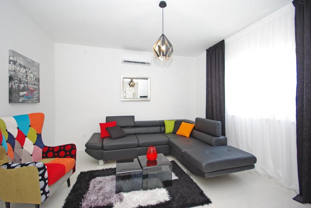 a living room with a couch and a chair at "NM" Luxury apartments in Split