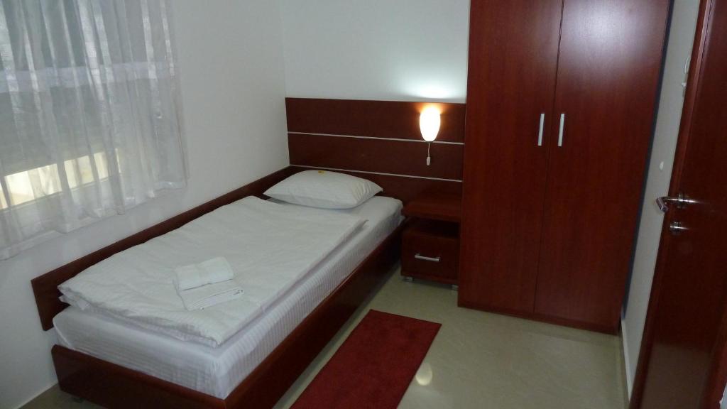 Postel nebo postele na pokoji v ubytování Guesthouse Villa Inn