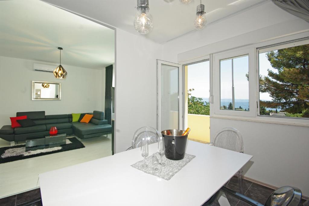 a living room with a white table and a couch at "NM" Luxury apartments in Split