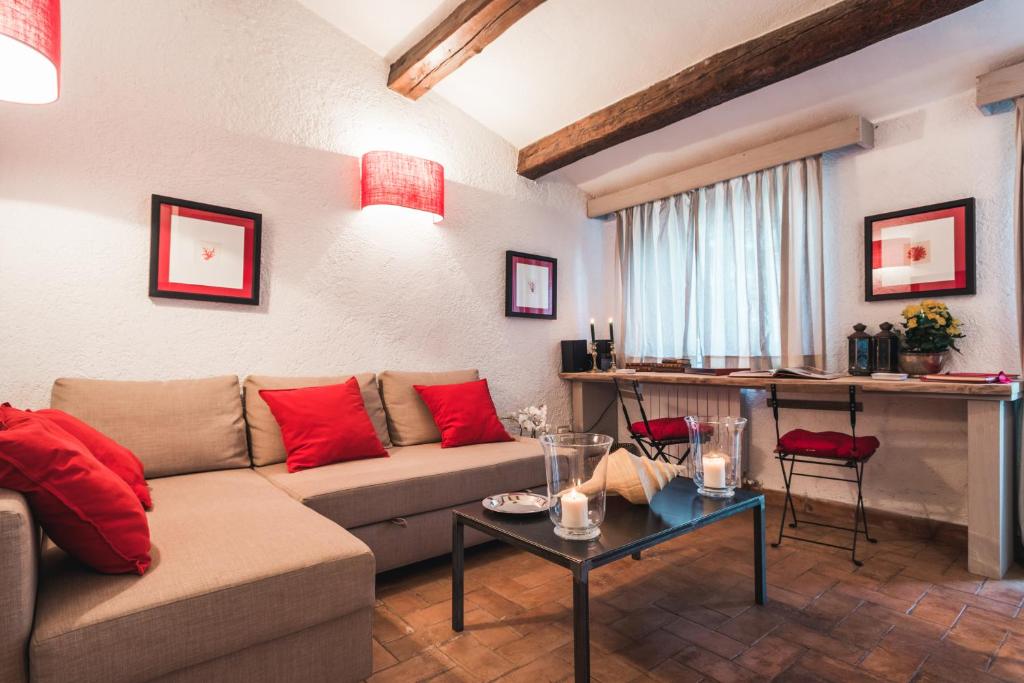 a living room with a couch and a table at Borgo degli Ulivi in Porto Ercole