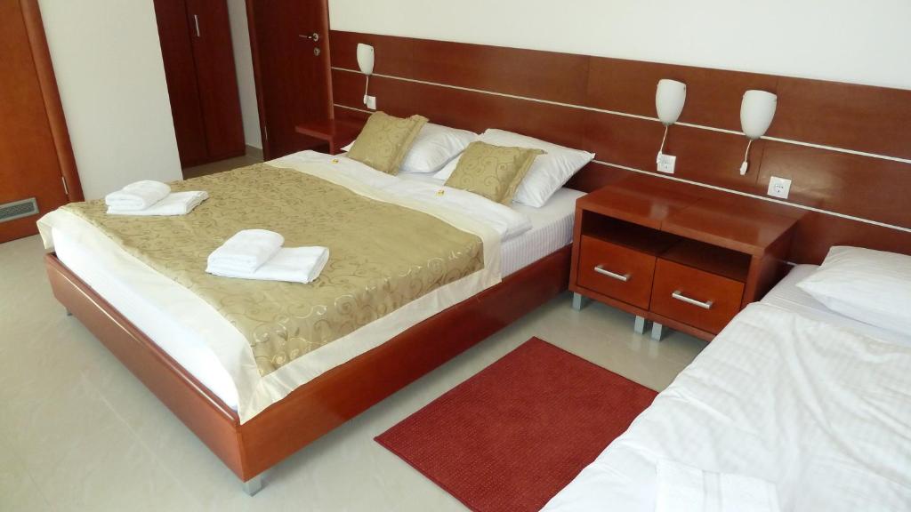 Postel nebo postele na pokoji v ubytování Guesthouse Villa Inn