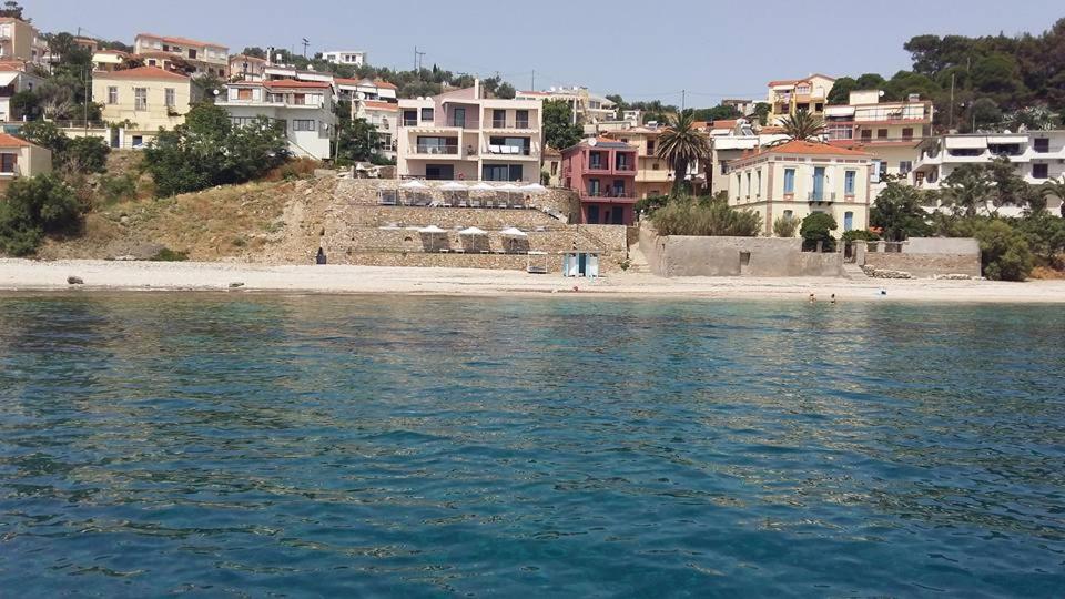 a view of a beach and houses from the water at Mare Studios Exclusive in Plomarion