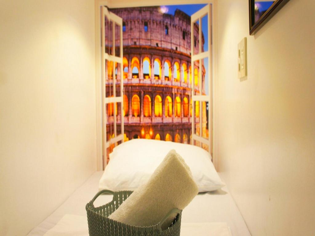 Una cama o camas en una habitación de Shejoje Poshtel Hostel
