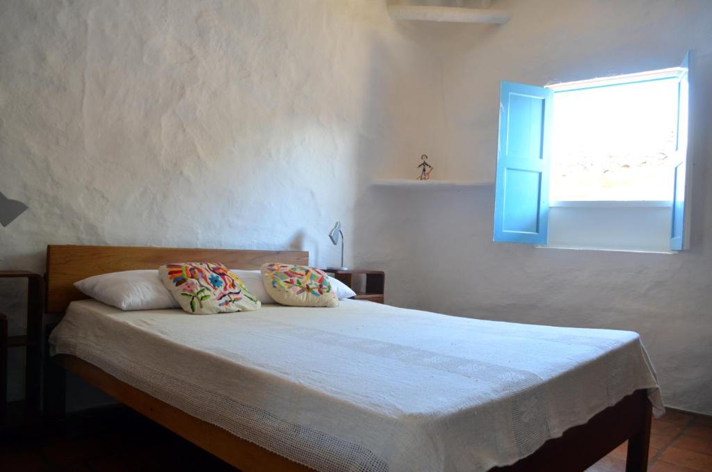 Postel nebo postele na pokoji v ubytování Albahaca Hospedaje Tienda