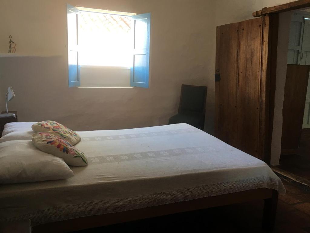 A bed or beds in a room at Albahaca Hospedaje Tienda