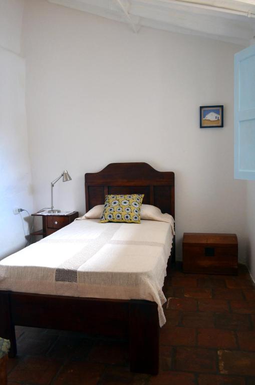 A bed or beds in a room at Albahaca Hospedaje Tienda