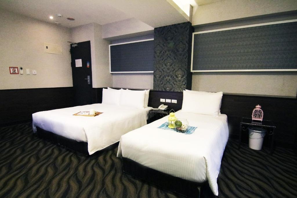 Postel nebo postele na pokoji v ubytování Hotel 6 - Ximen