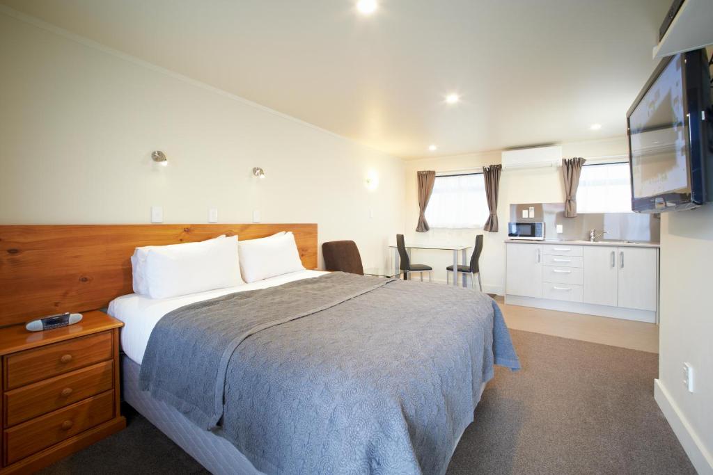 Postel nebo postele na pokoji v ubytování Auto Lodge Motel