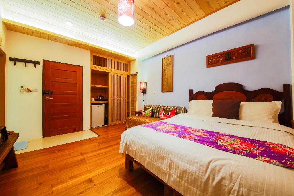 Postel nebo postele na pokoji v ubytování Tang Chao B&B