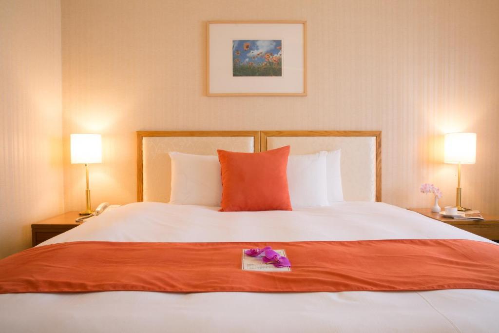 Postel nebo postele na pokoji v ubytování Hotel Riverview Taipei