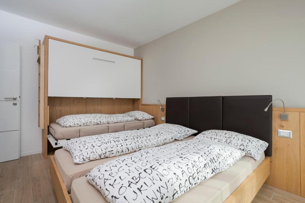 Postel nebo postele na pokoji v ubytování Appartamento Mirabell