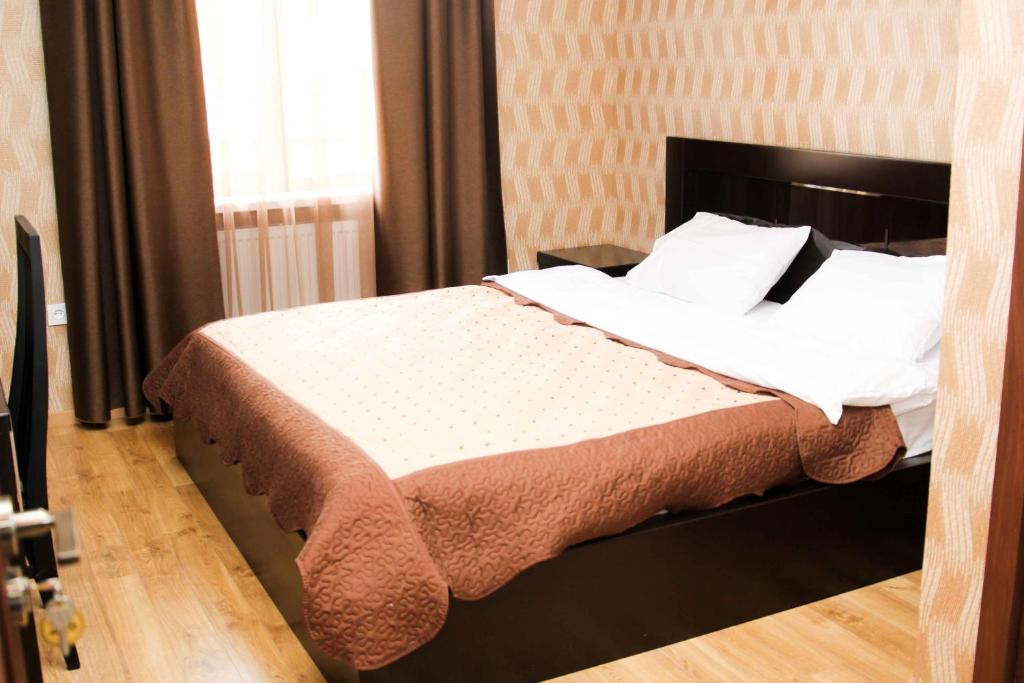 Postel nebo postele na pokoji v ubytování Hotel New Telavi