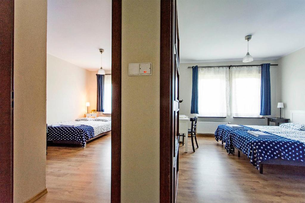 Postel nebo postele na pokoji v ubytování Kurort Stara Wędzarnia