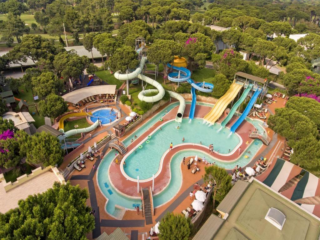an aerial view of a pool at a water park at Pine Beach Belek in Belek