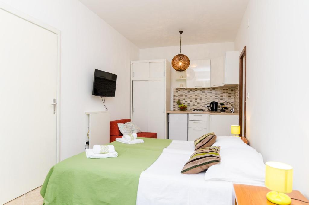 Una cama o camas en una habitaci&oacute;n de Apartments Versus