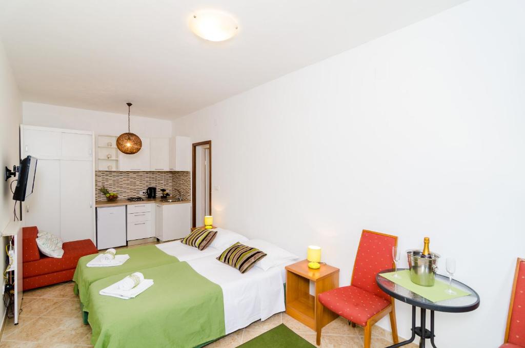 Una cama o camas en una habitaci&oacute;n de Apartments Versus