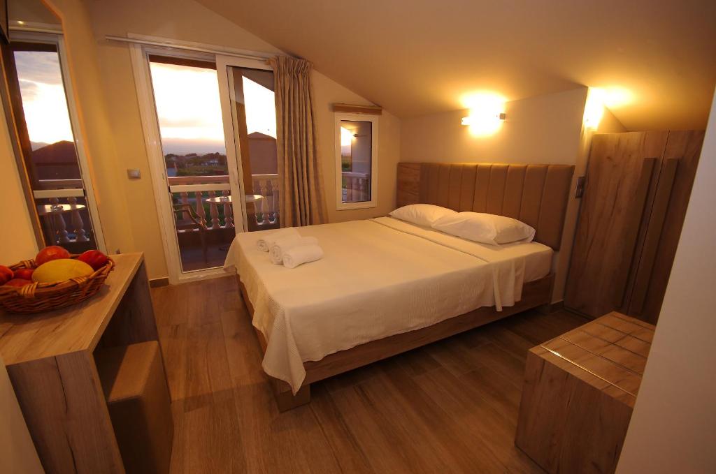 Postel nebo postele na pokoji v ubytování John & Eve Hotel