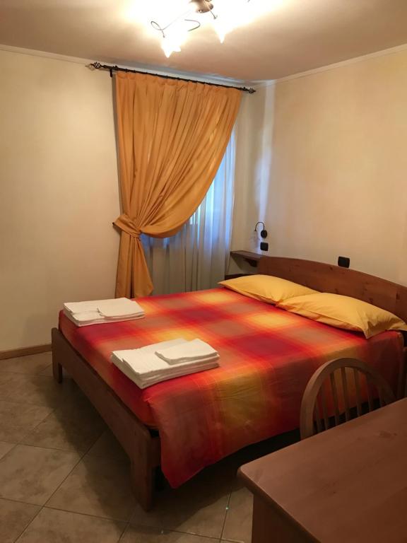 Postel nebo postele na pokoji v ubytování Locanda La Posta Nöa - B&B