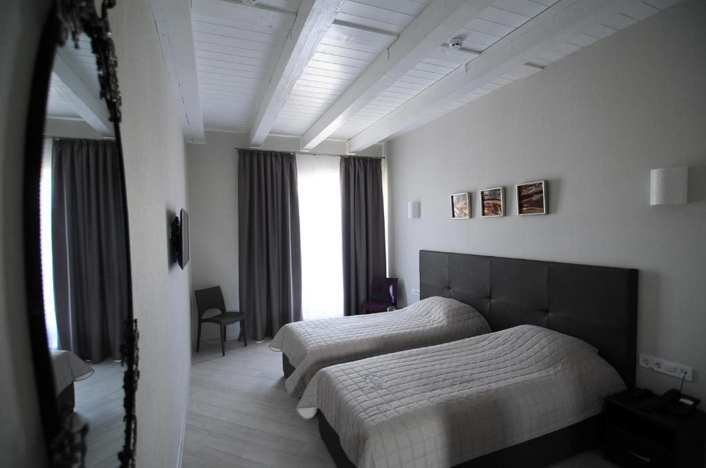 Postel nebo postele na pokoji v ubytování Hotel Nika 2