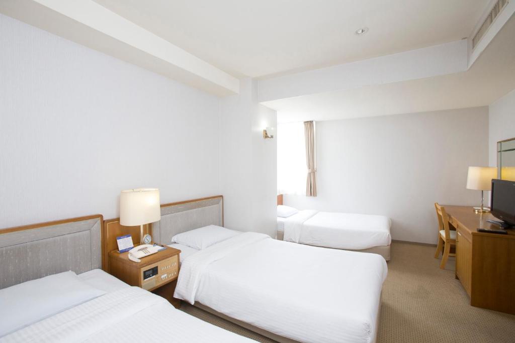 Postel nebo postele na pokoji v ubytování Tetoranze Makuhari Inagekaigan Hotel