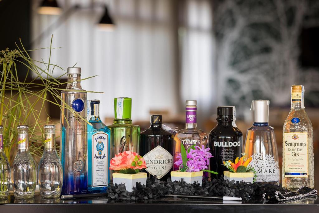 a group of bottles of alcohol sitting on a table at AQUA Hotel Bertran Park in Lloret de Mar