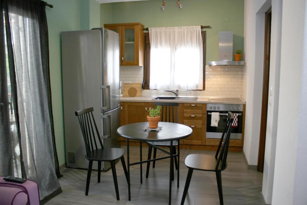Kuchyň nebo kuchyňský kout v ubytování Aphelion Holiday Apartments