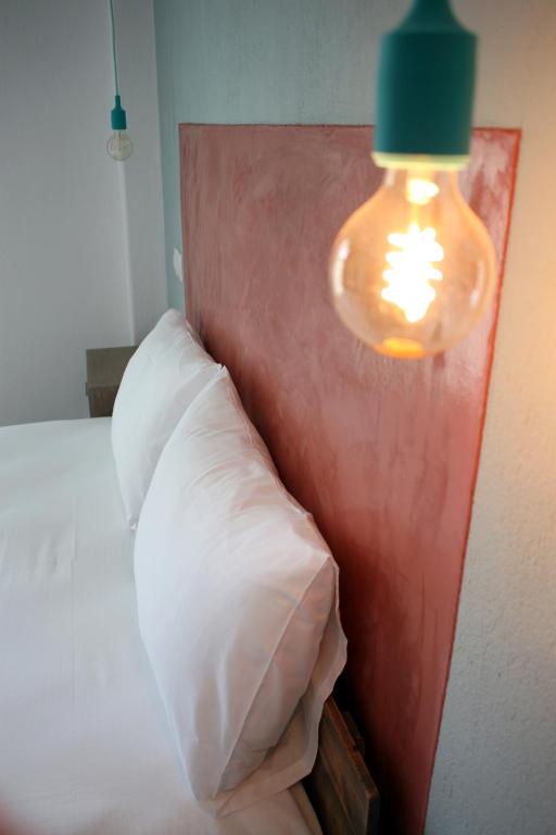 Postel nebo postele na pokoji v ubytování Aphelion Holiday Apartments