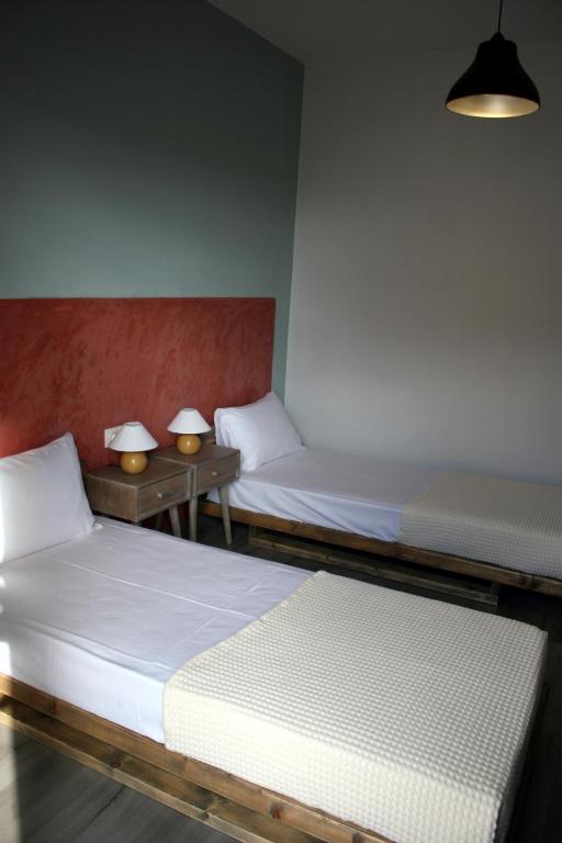 Postel nebo postele na pokoji v ubytování Aphelion Holiday Apartments
