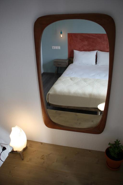 Postel nebo postele na pokoji v ubytování Aphelion Holiday Apartments