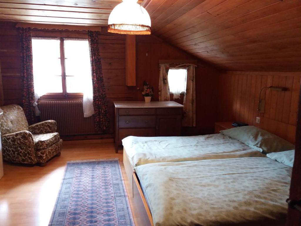 Postel nebo postele na pokoji v ubytování Hôtel du Chamois