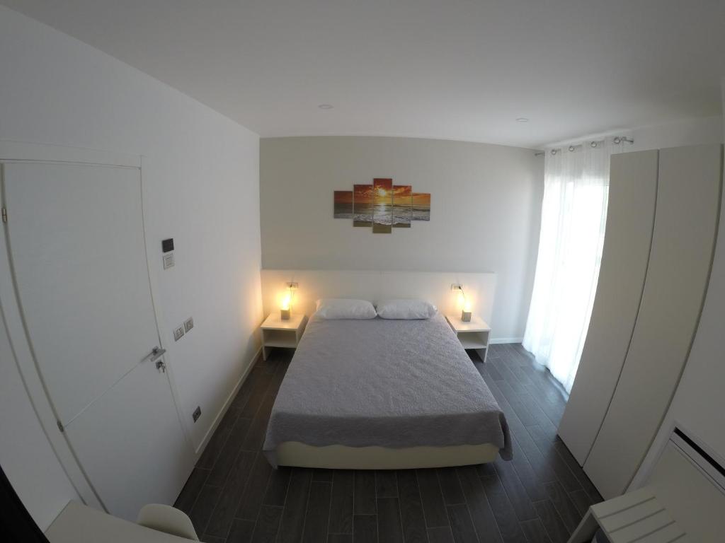 Postel nebo postele na pokoji v ubytování B&B Villa del Lago