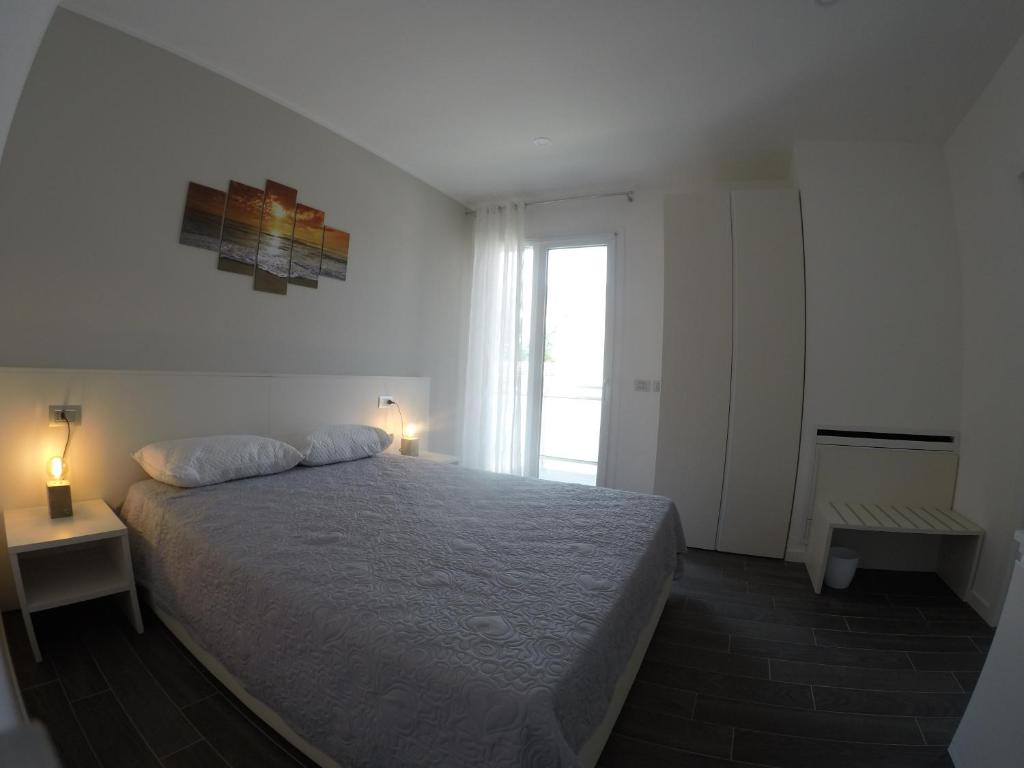 Postel nebo postele na pokoji v ubytování B&B Villa del Lago