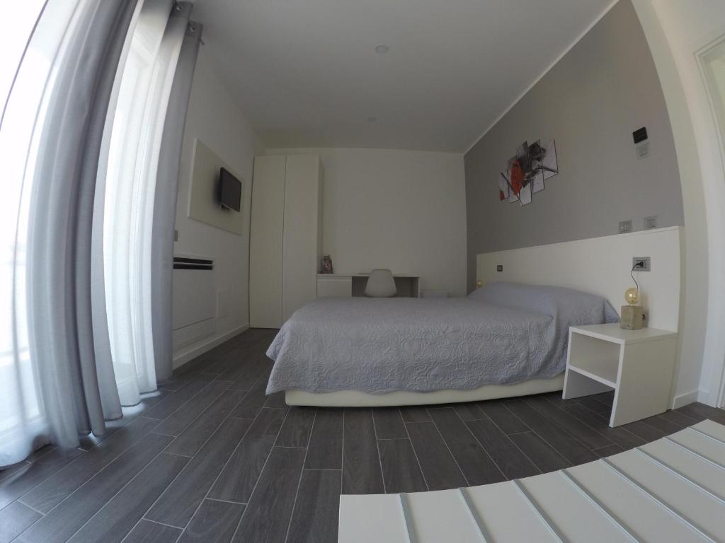 Postel nebo postele na pokoji v ubytování B&B Villa del Lago