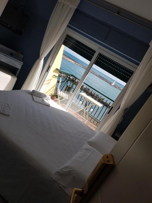 Postel nebo postele na pokoji v ubytování Hotel Zia Piera