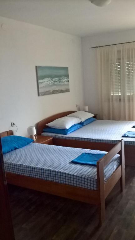 Postel nebo postele na pokoji v ubytování Apartments Krušvina