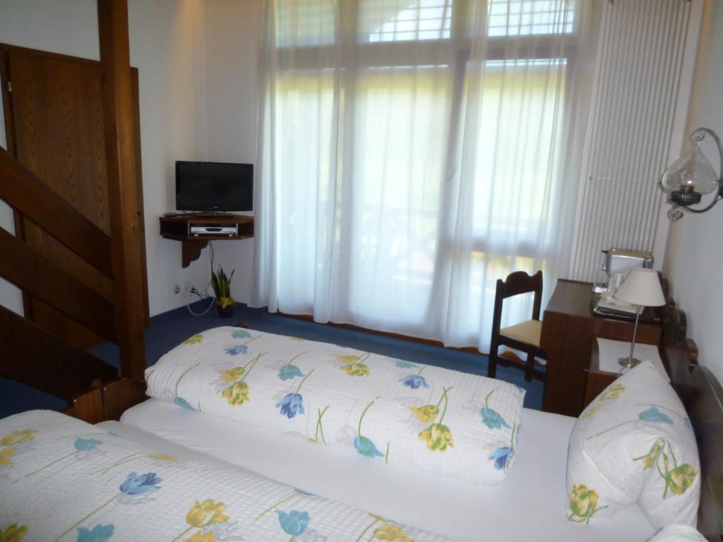 Postel nebo postele na pokoji v ubytování Hotel Bahnhof